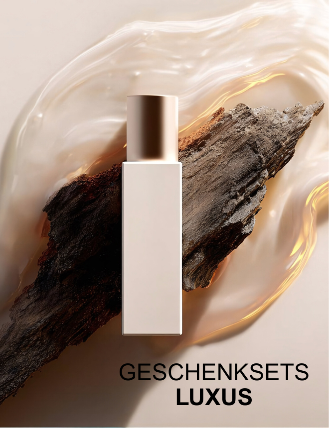 Geschenksets Luxus – edler Parfümflakon vor Holz und goldenem Farbverlauf