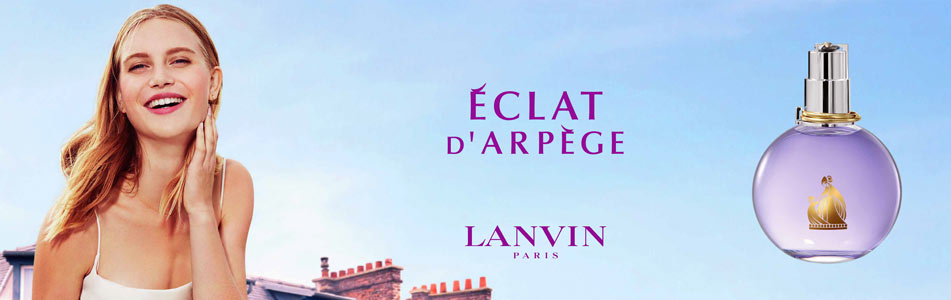 Werbung für Lanvin Parfum Éclat d’Arpège. Links lacht eine Frau vor blauem Himmel und Hausdächern, rechts ist ein runder, fliederfarbener Flakon mit goldener Verzierung abgebildet. In der Mitte der Schriftzug 'Éclat d’Arpège – Lanvin Paris'.
